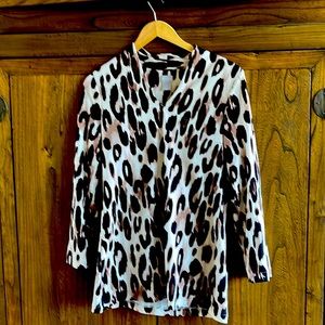 Chico’s leopard print tunic top . Size 0 which is comparable to a small medium